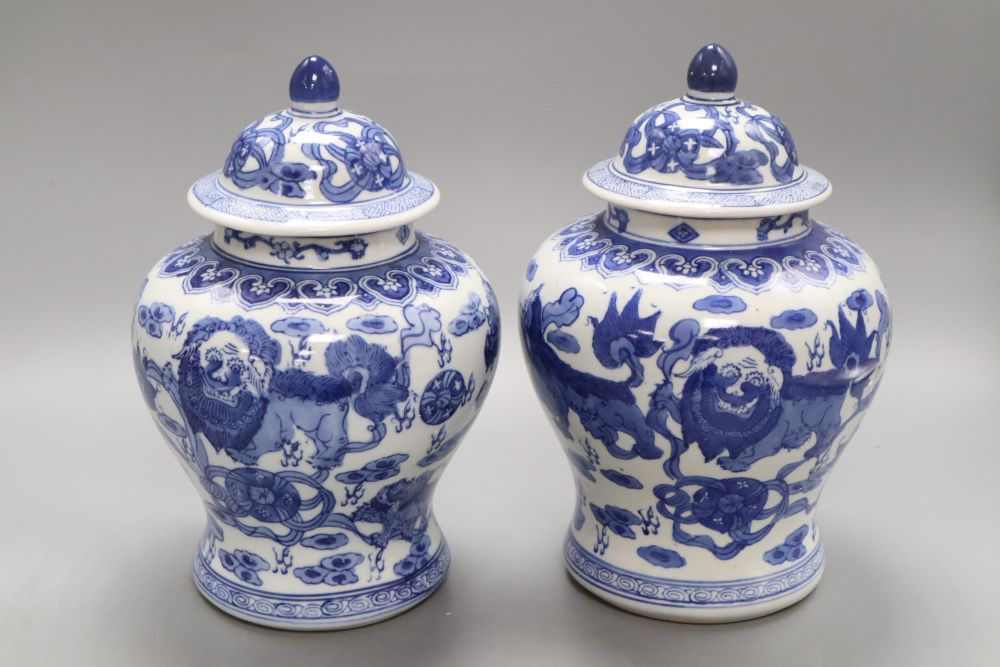 A pair of Chinese blue and white dragon vases, height 26cm